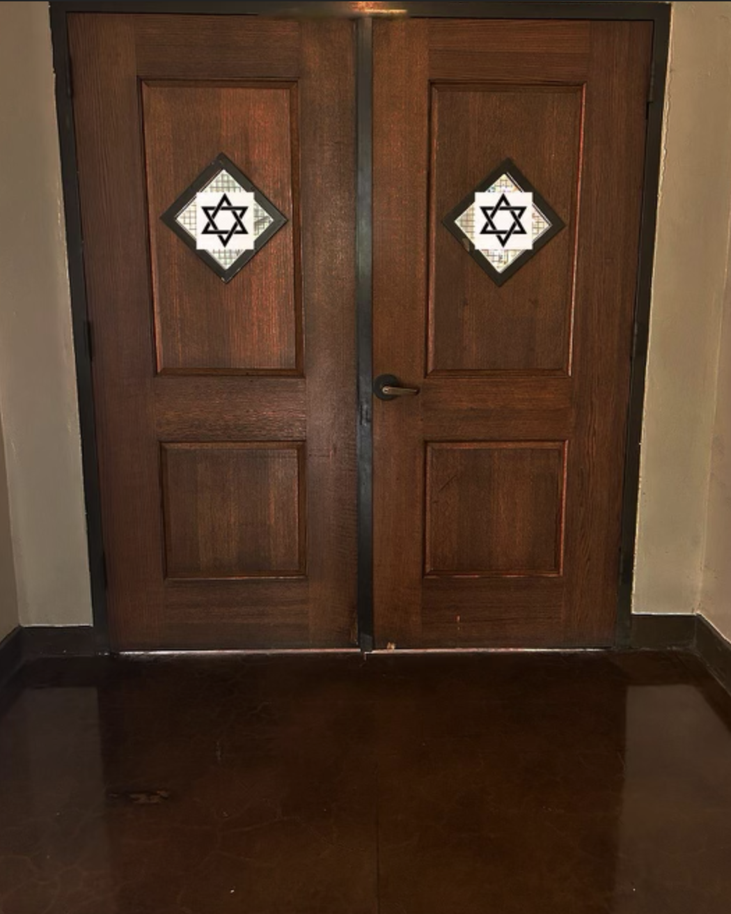 Image of Kerckoff doors, edited to show a Star of David in the window.